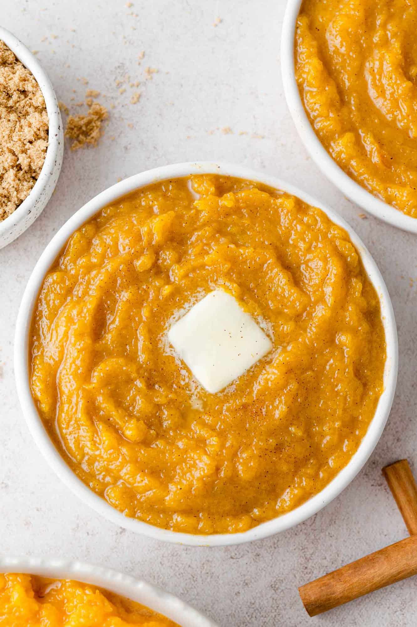 Butter melting on a bowl of squash mash.