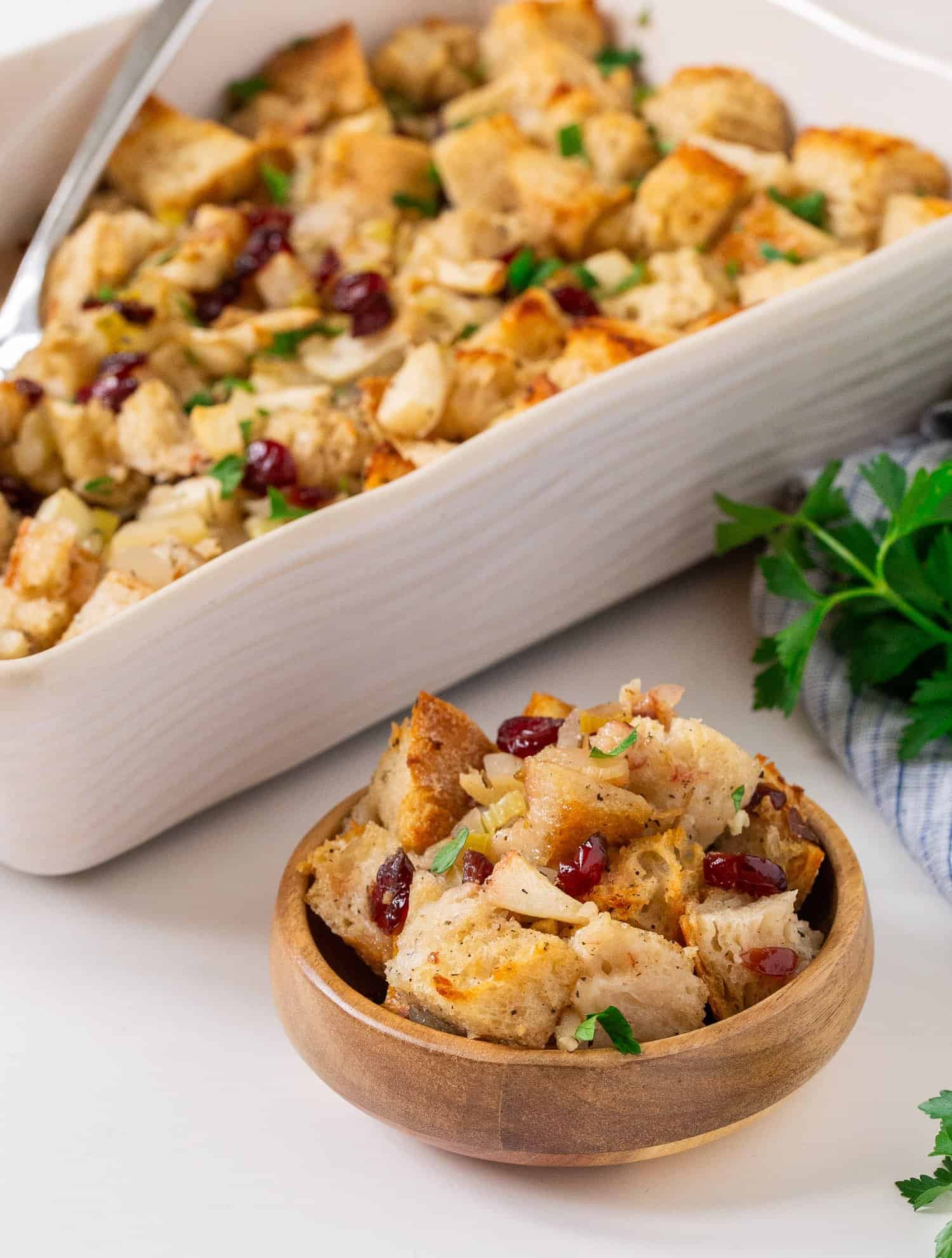 Stuffing scooped into a small wooden bowl.