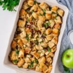 Overhead view of apple stuffing in a casserole dish.