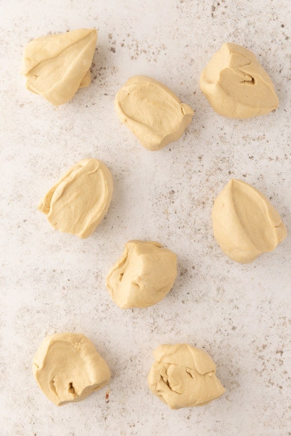 Pretzel dough divided into 8 even portions.