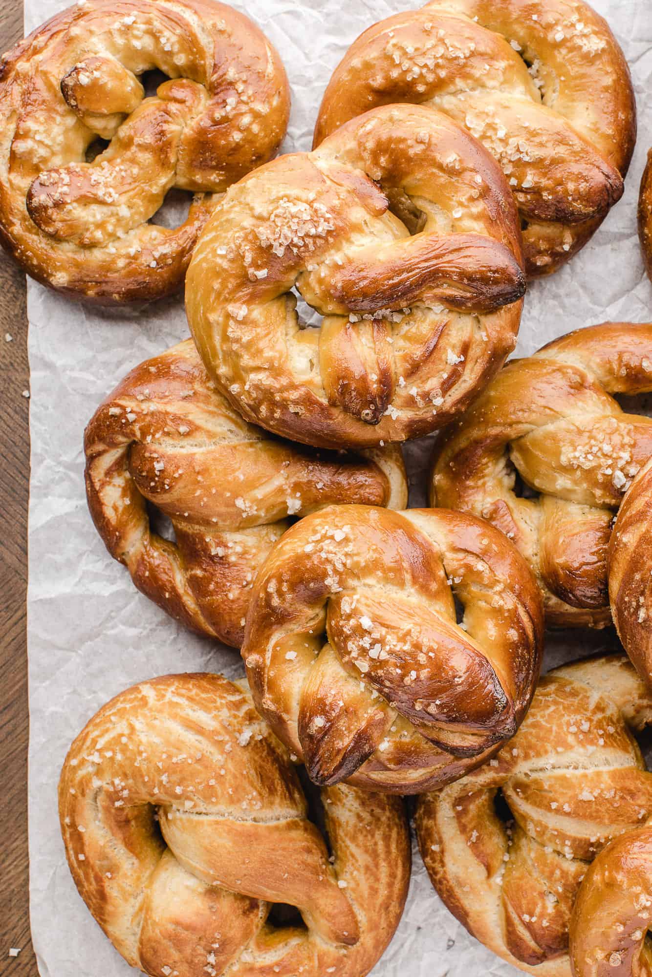 Homemade soft pretzels on a sheet pan.