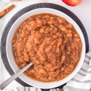 Crockpot applesauce in a large white bowl.