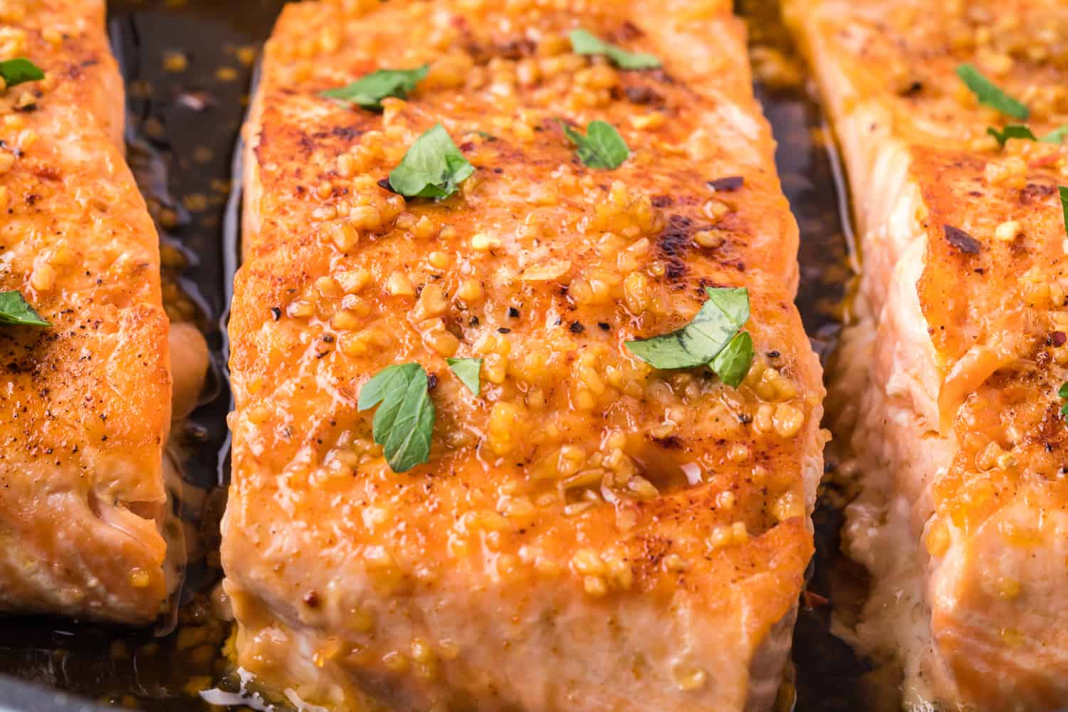 Close up view of salmon with honey garlic glaze.