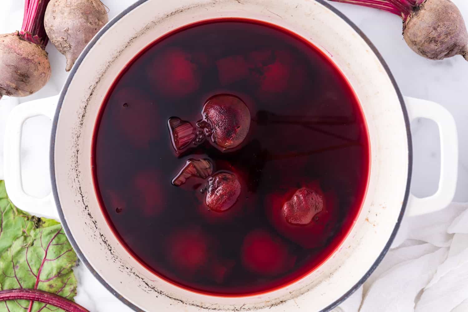 Beets in water, after cooking, water a deep pinkish purple.