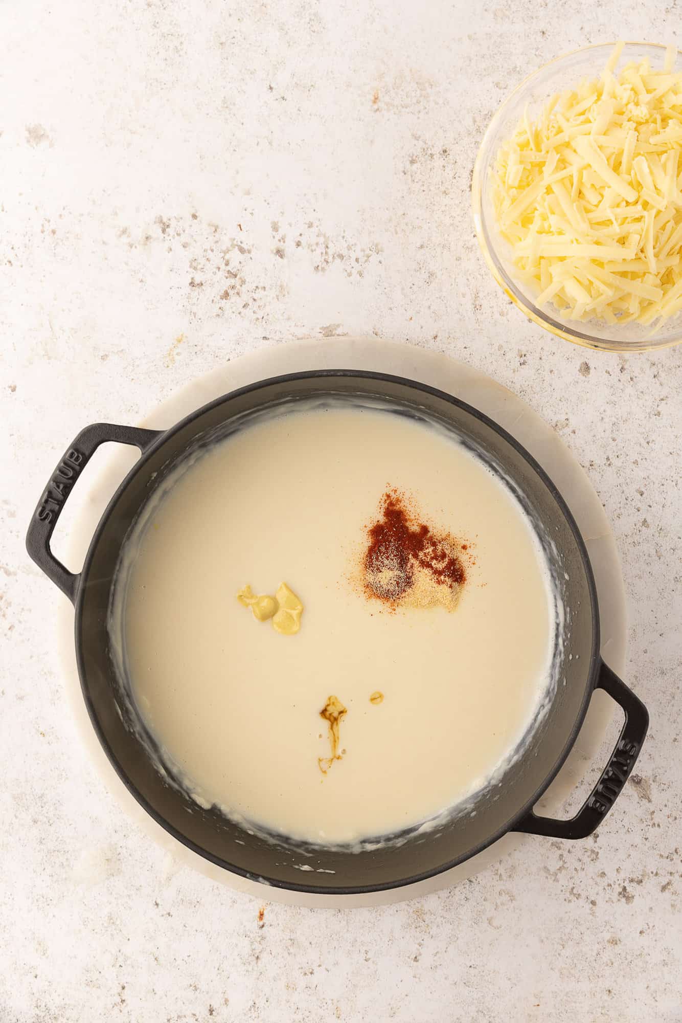 Seasonings added to white sauce.