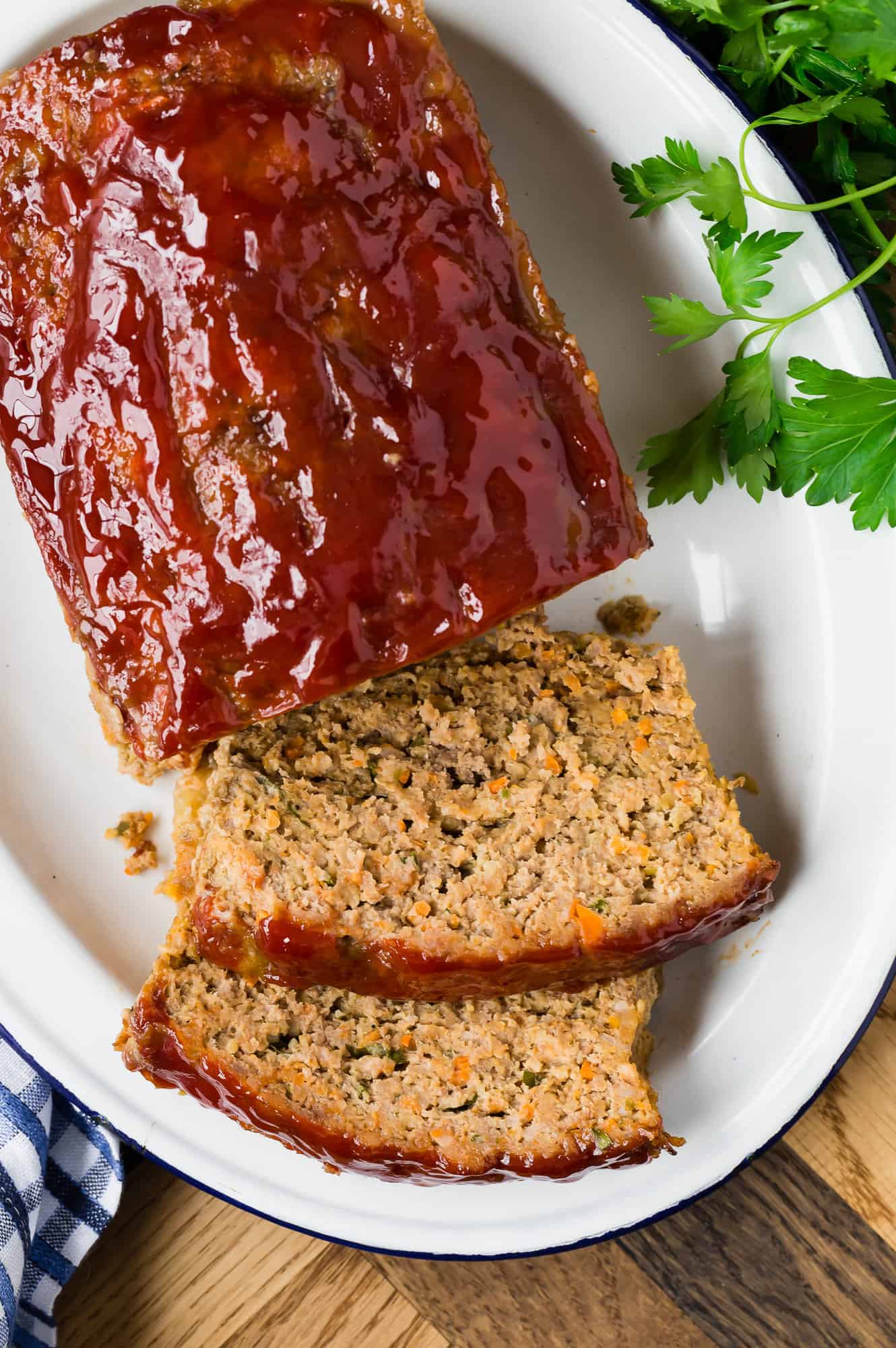 Overhead view of partially sliced meatloaf.