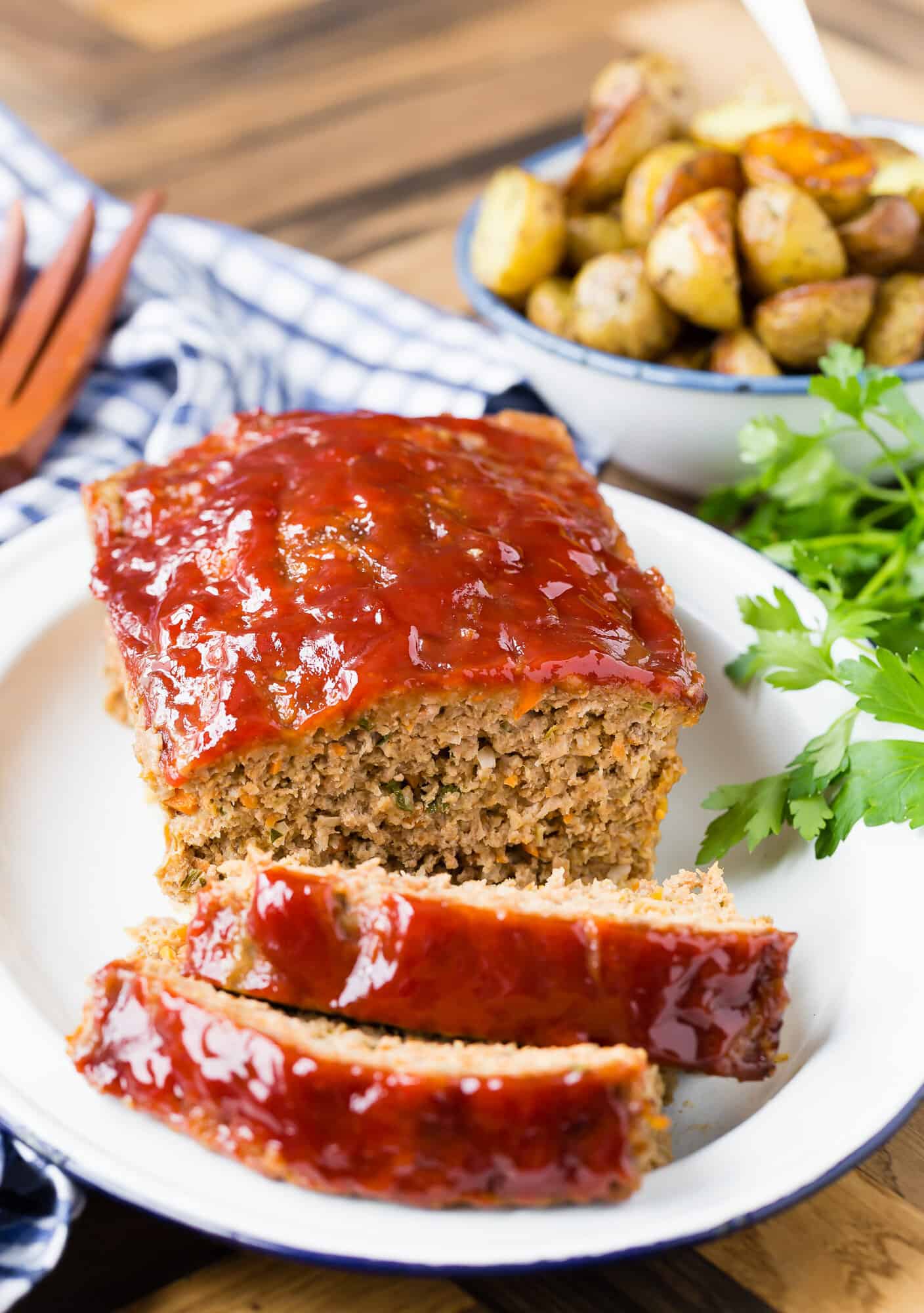 Classic meatloaf with a tomato glaze, a couple of slices sliced.