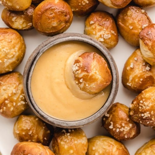 Beer cheese dip with soft pretzel bites.