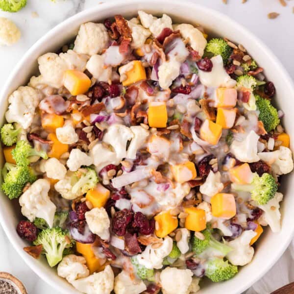 Overhead view of broccoli cauliflower salad in a bowl.