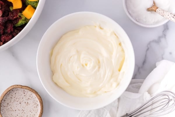 Salad dressing in a white bowl.