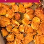 Parmesan potatoes Pinterest image with text overlay with the recipe name.