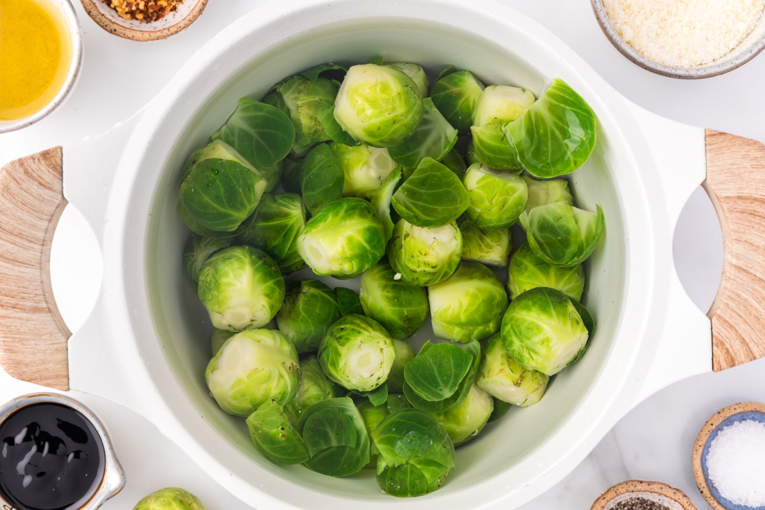 Brussels sprouts in boiling water in a pan.