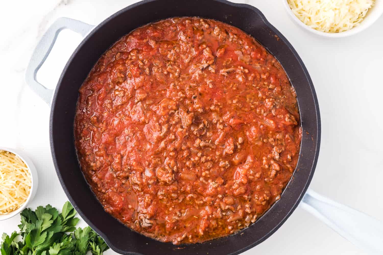 Pasta sauce added to ground beef.