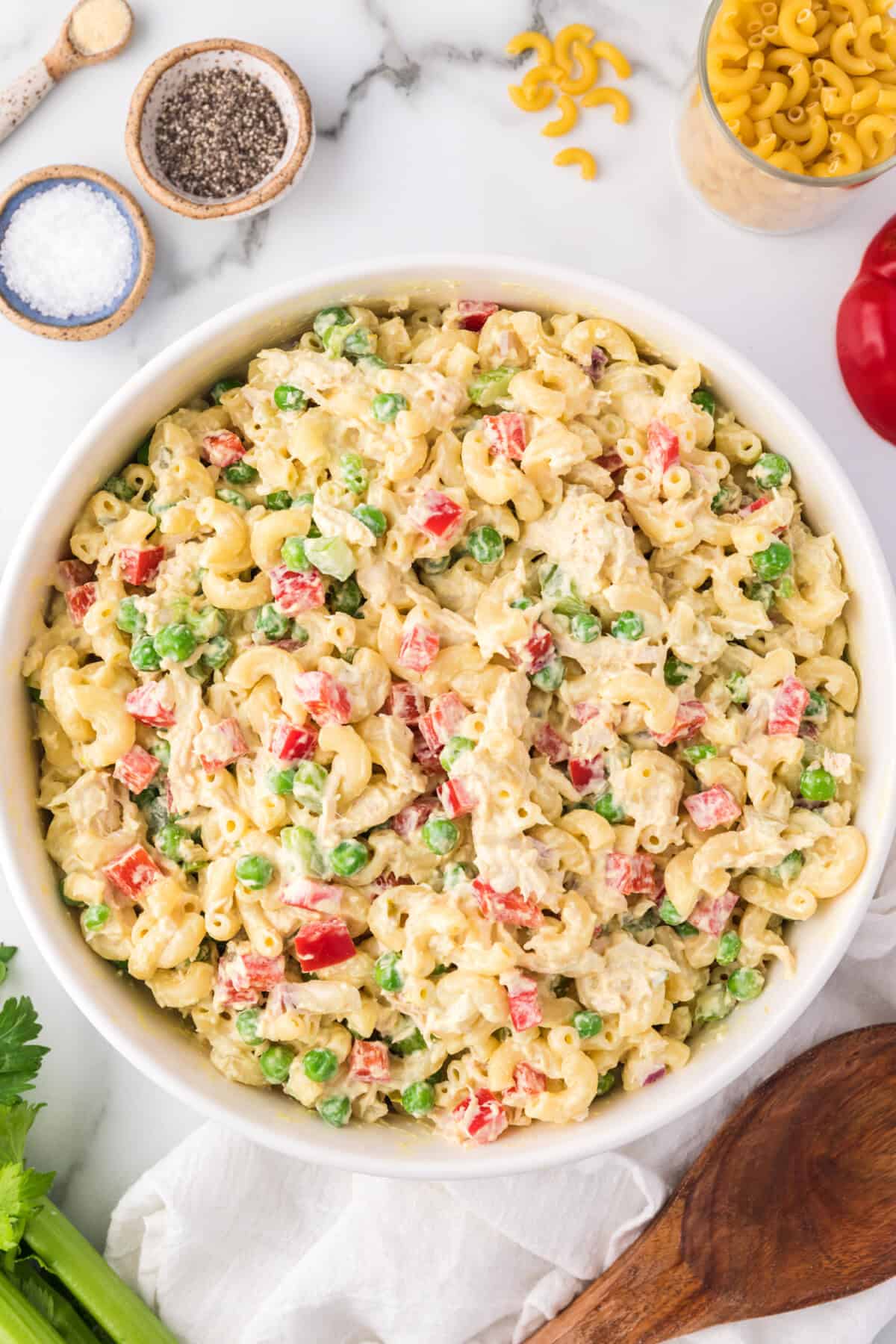 Overhead view of chicken macaroni salad in a large bowl.