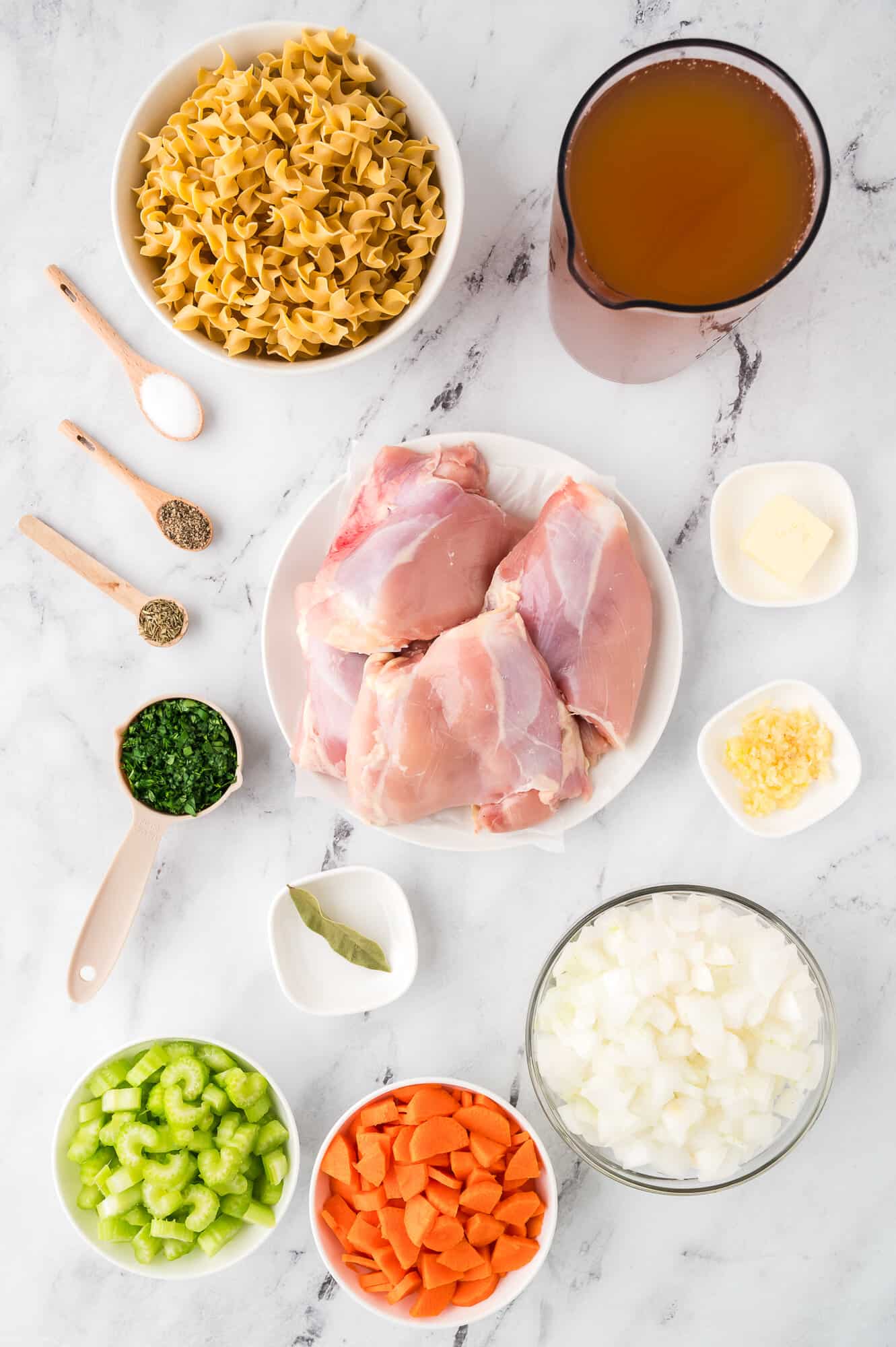 Ingredients for homemade chicken noodle soup.