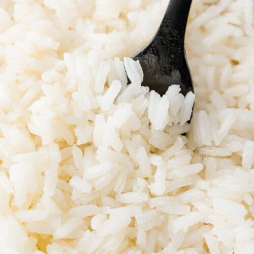 Fluffy jasmine rice with a black fork.