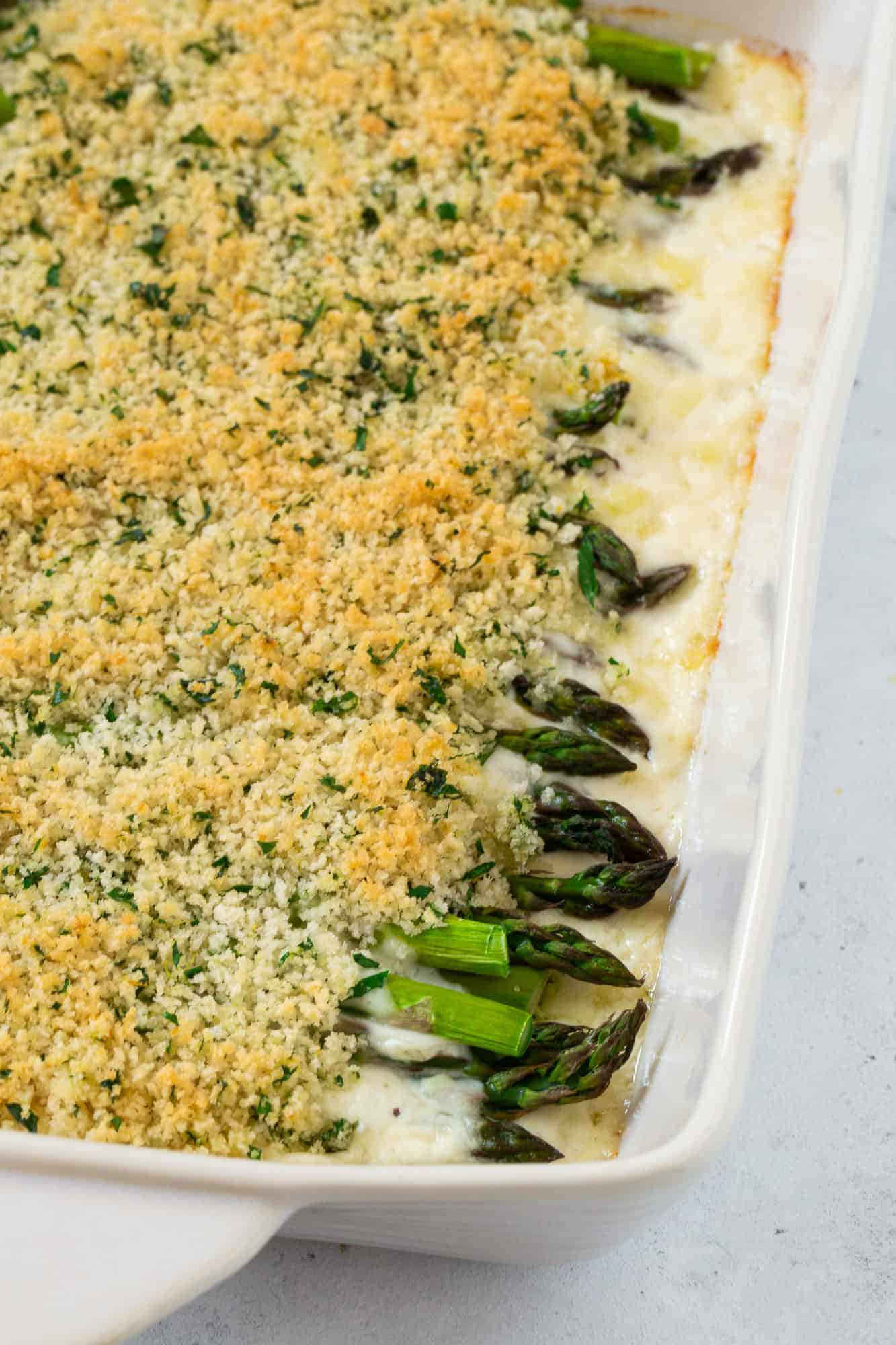 Asparagus casserole topped with golden brown seasoned bread crumbs.