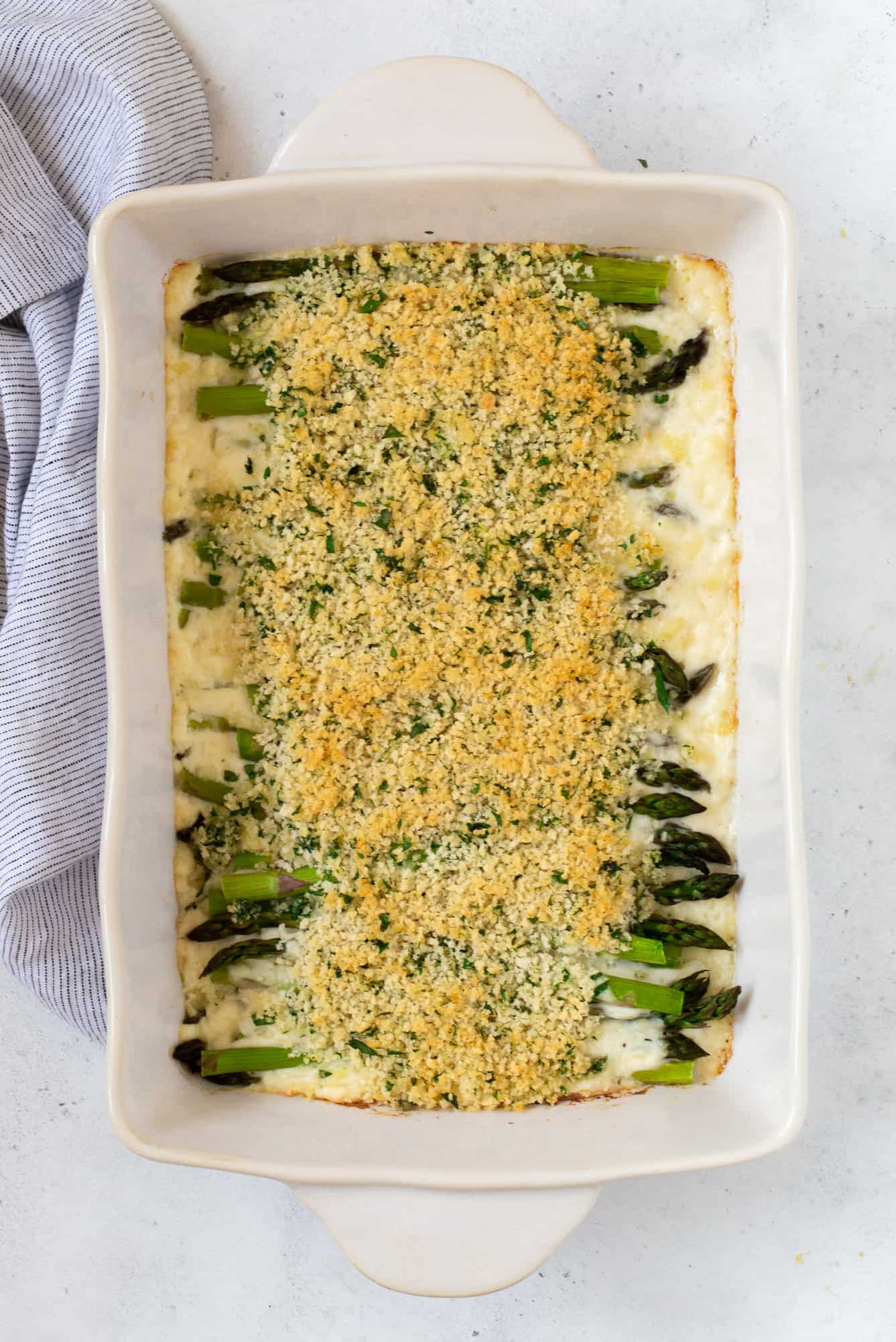 Finished asparagus casserole with toasted breadcrumbs on top.