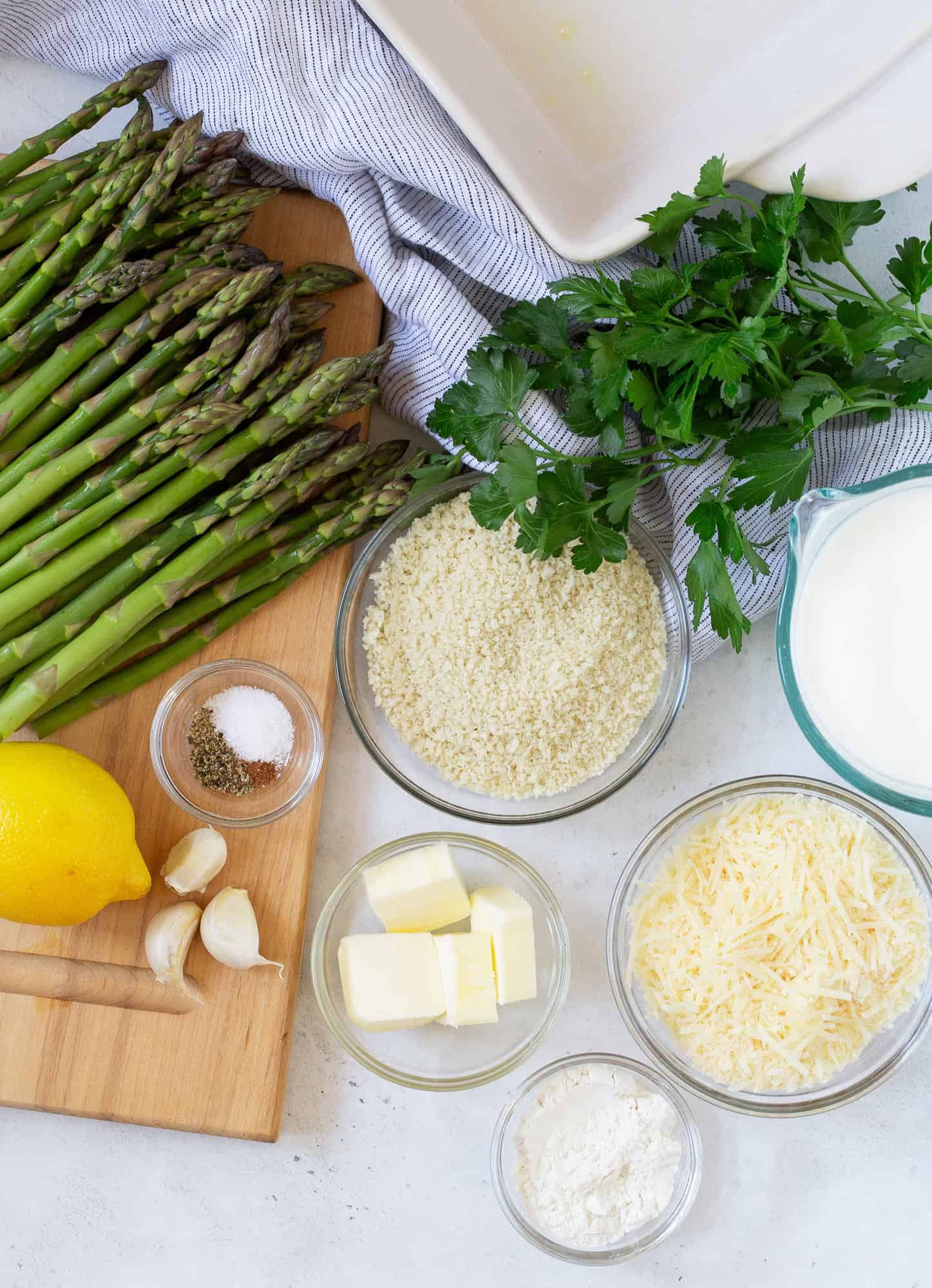 Overhead view of ingredients needed for recipe, including fresh asparagus.