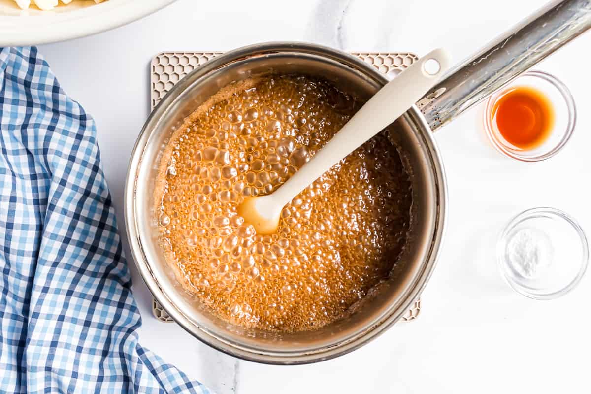 Caramel forming in saucepan.