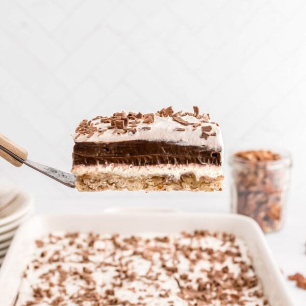 Chocolate delight, a layered chocolate dessert, held on a spatula.