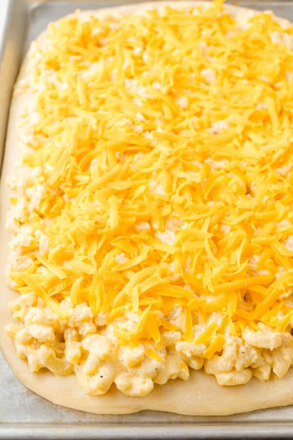 Cheese added to the top of the macaroni and cheese.