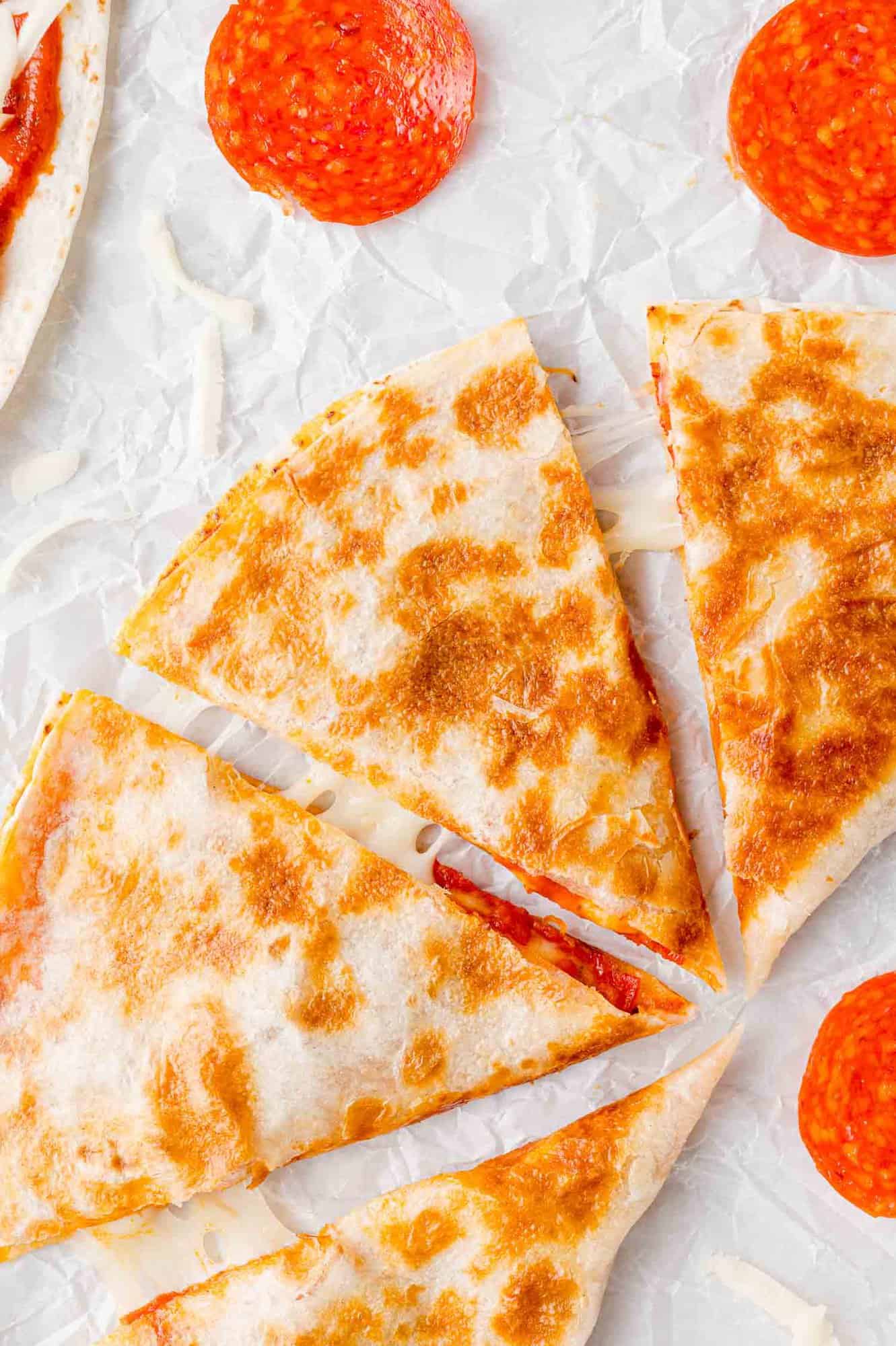 Pizza quesadilla, cut into four wedges.