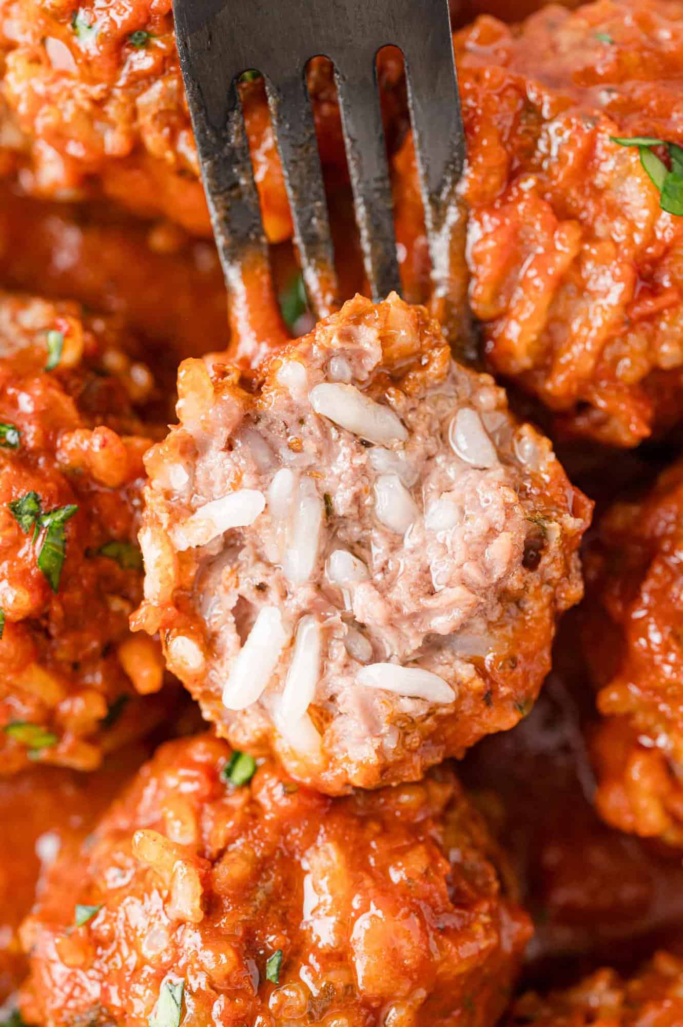 Porcupine meatball cut open to show filling.