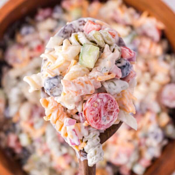 Ranch pasta salad on a serving spoon.