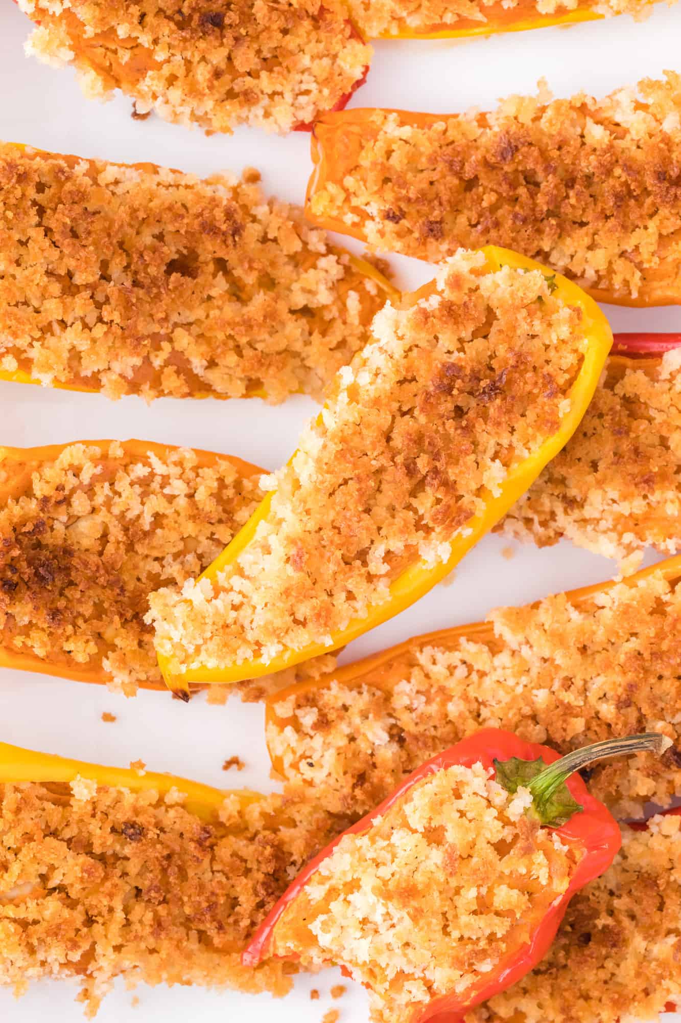 Stuffed mini peppers with a browned panko topping.