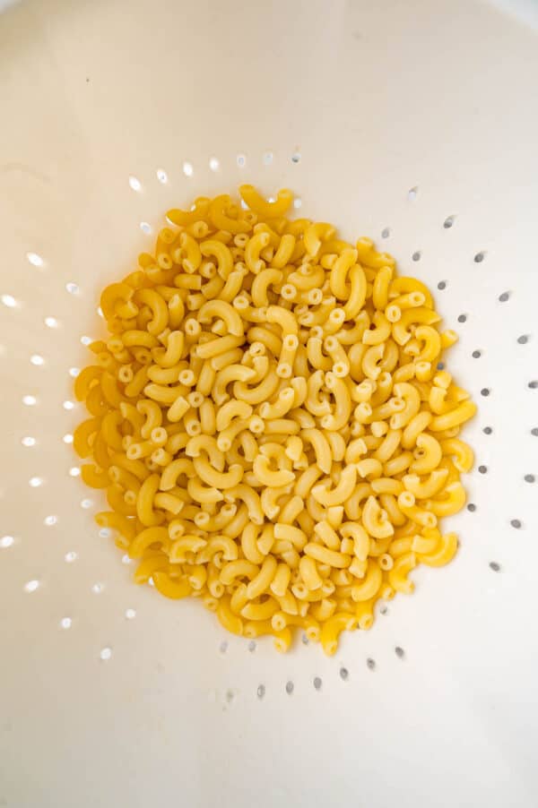 Cooked pasta in a colander.