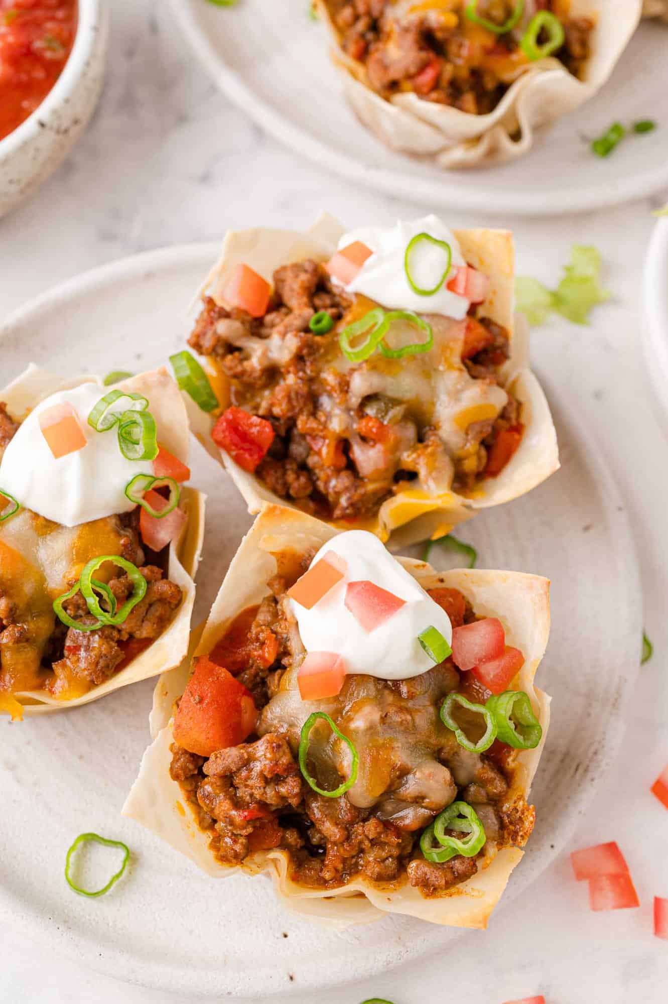 Taco cups with toppings.