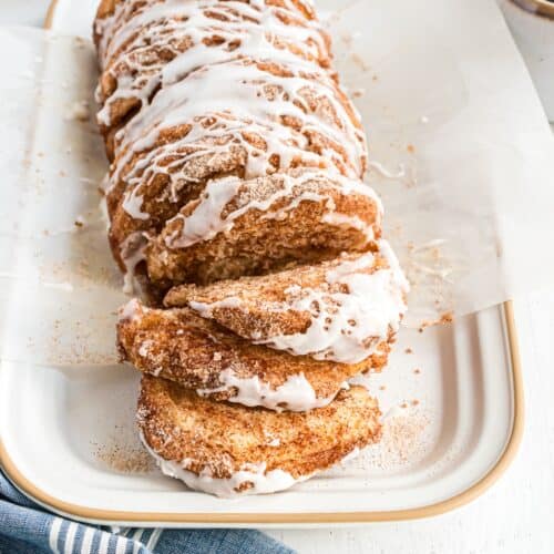 Cinnamon sugar pull apart bread, partially pulled apart to show layers.