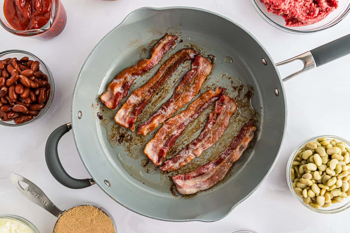 Bacon cooking in a pan.