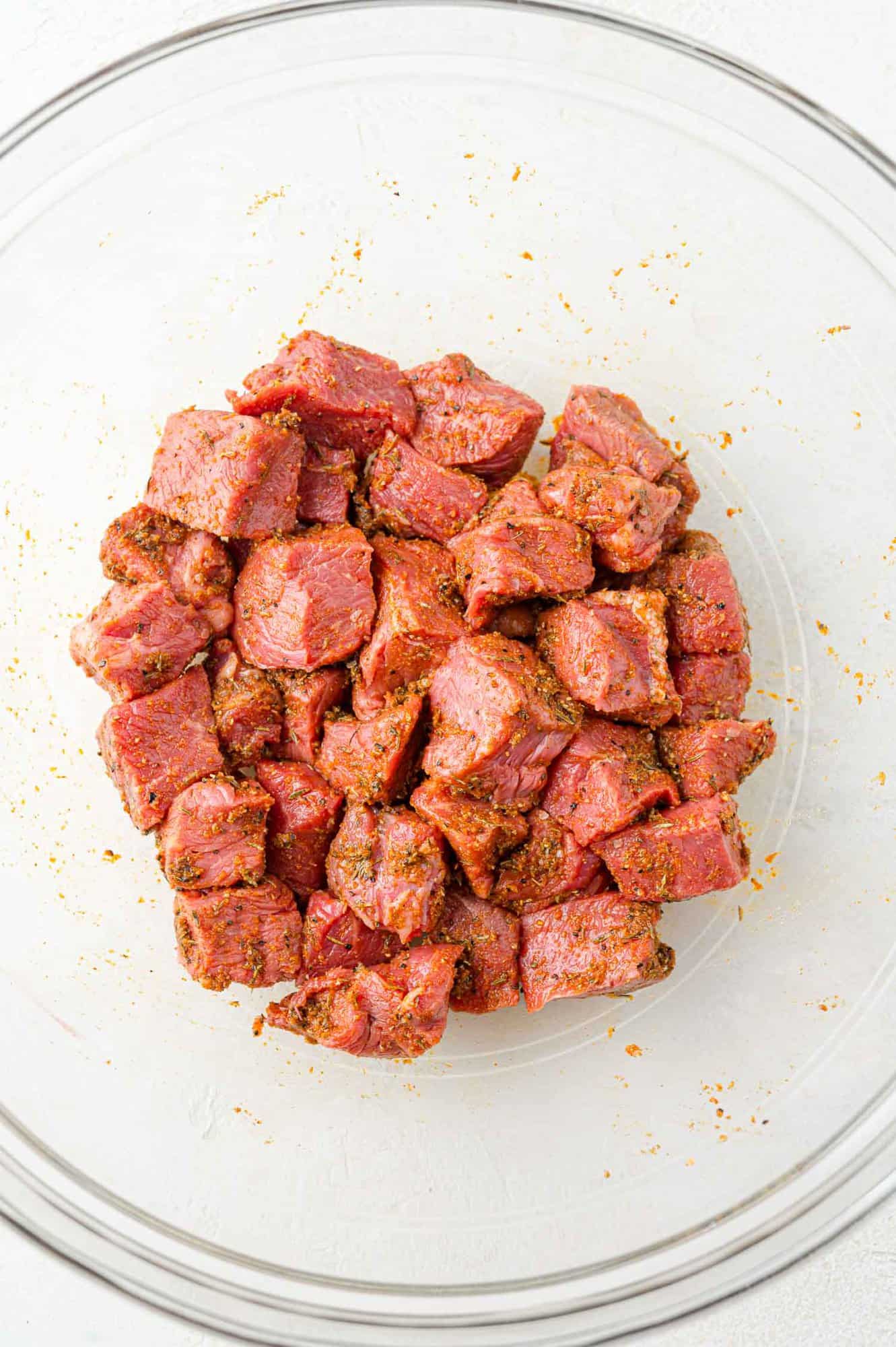 Steak bites tossed with marinade.