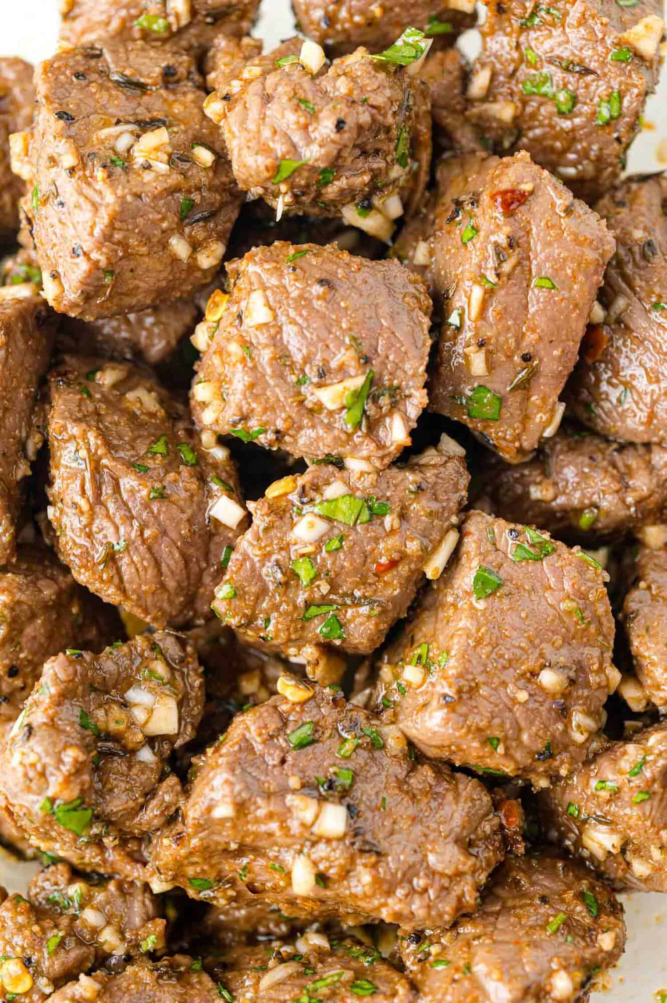 Steak bites, tossed with garlic butter.