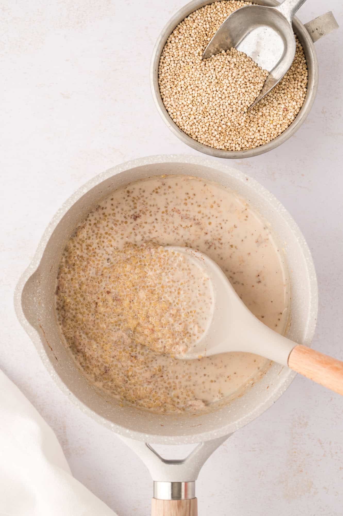 Quinoa on spoon, showing cooked texture, before resting.