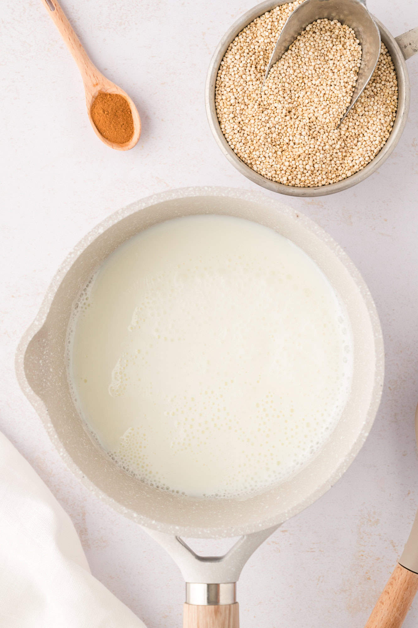 Milk and water in saucepan.