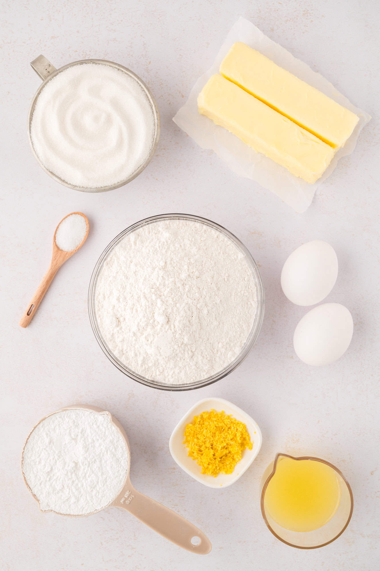Overhead view of ingredients needed for recipe, lemon already zested and juiced.