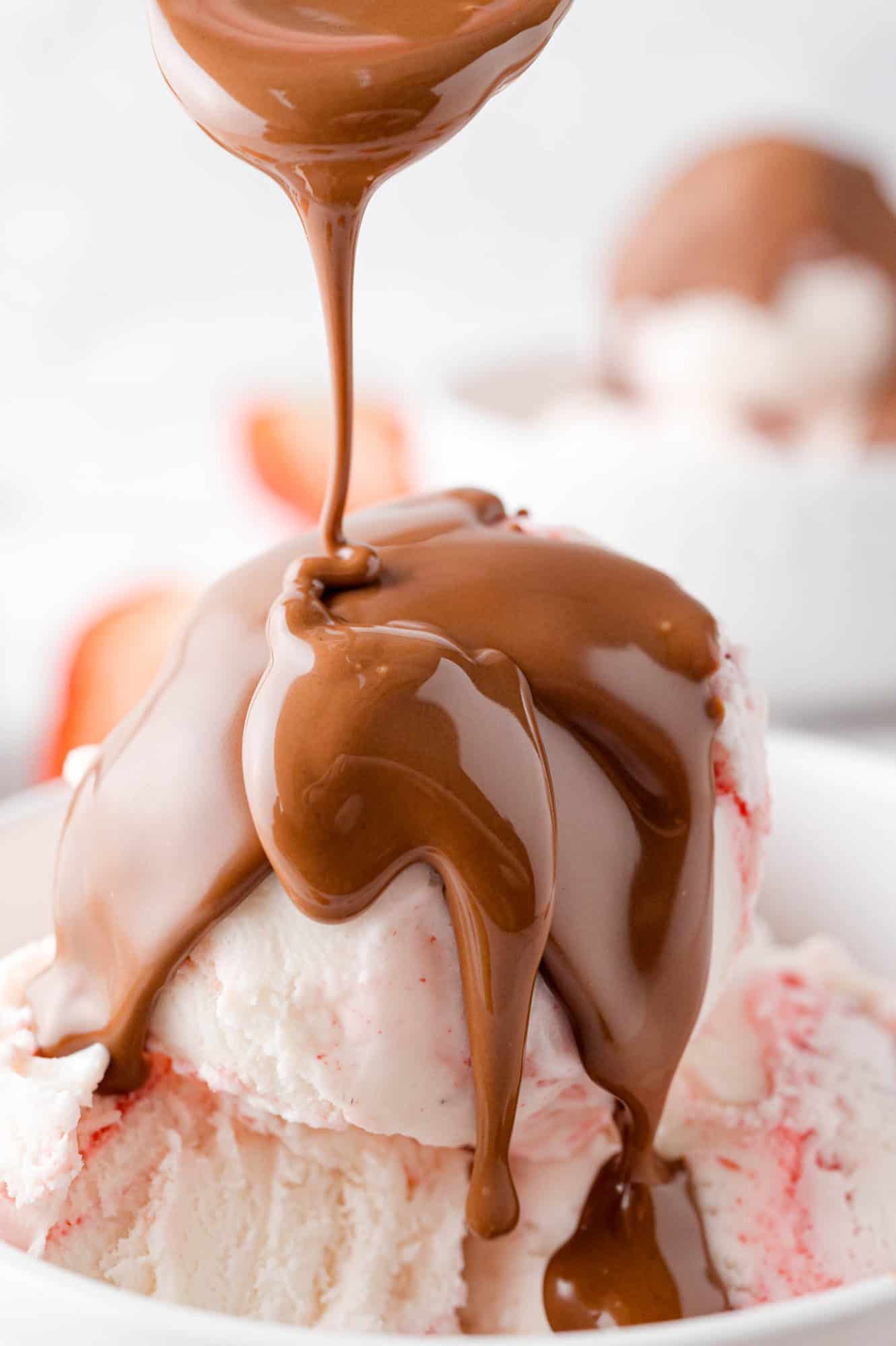 Magic shell being poured on ice cream, partially hardened.