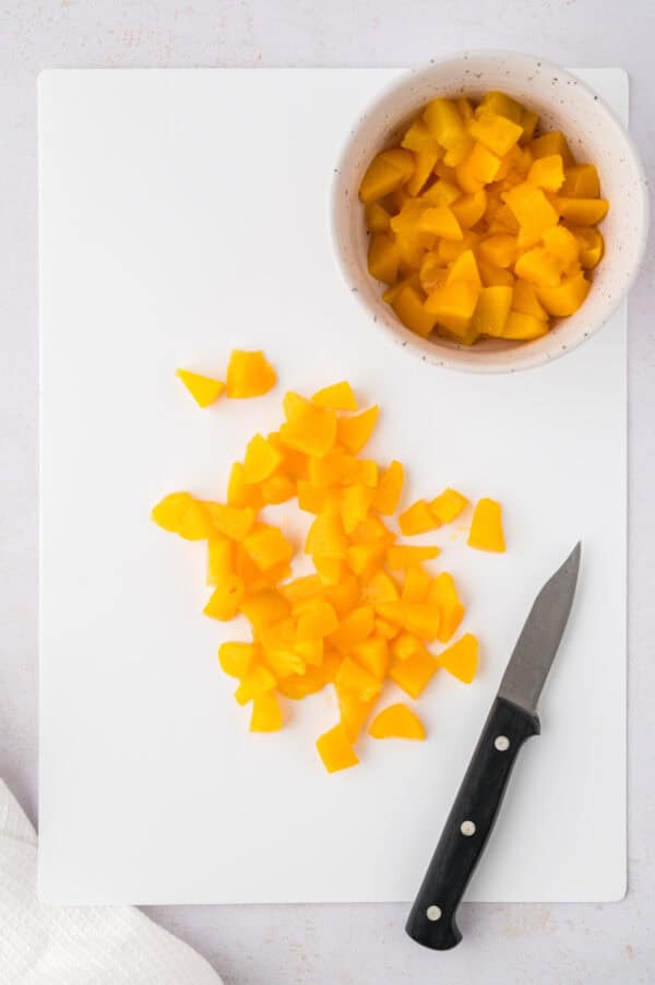 Canned peaches being diced.