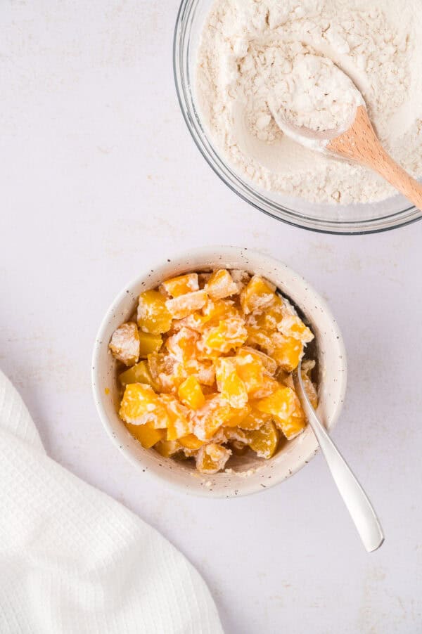 Flour mixture mixed with canned chopped peaches.