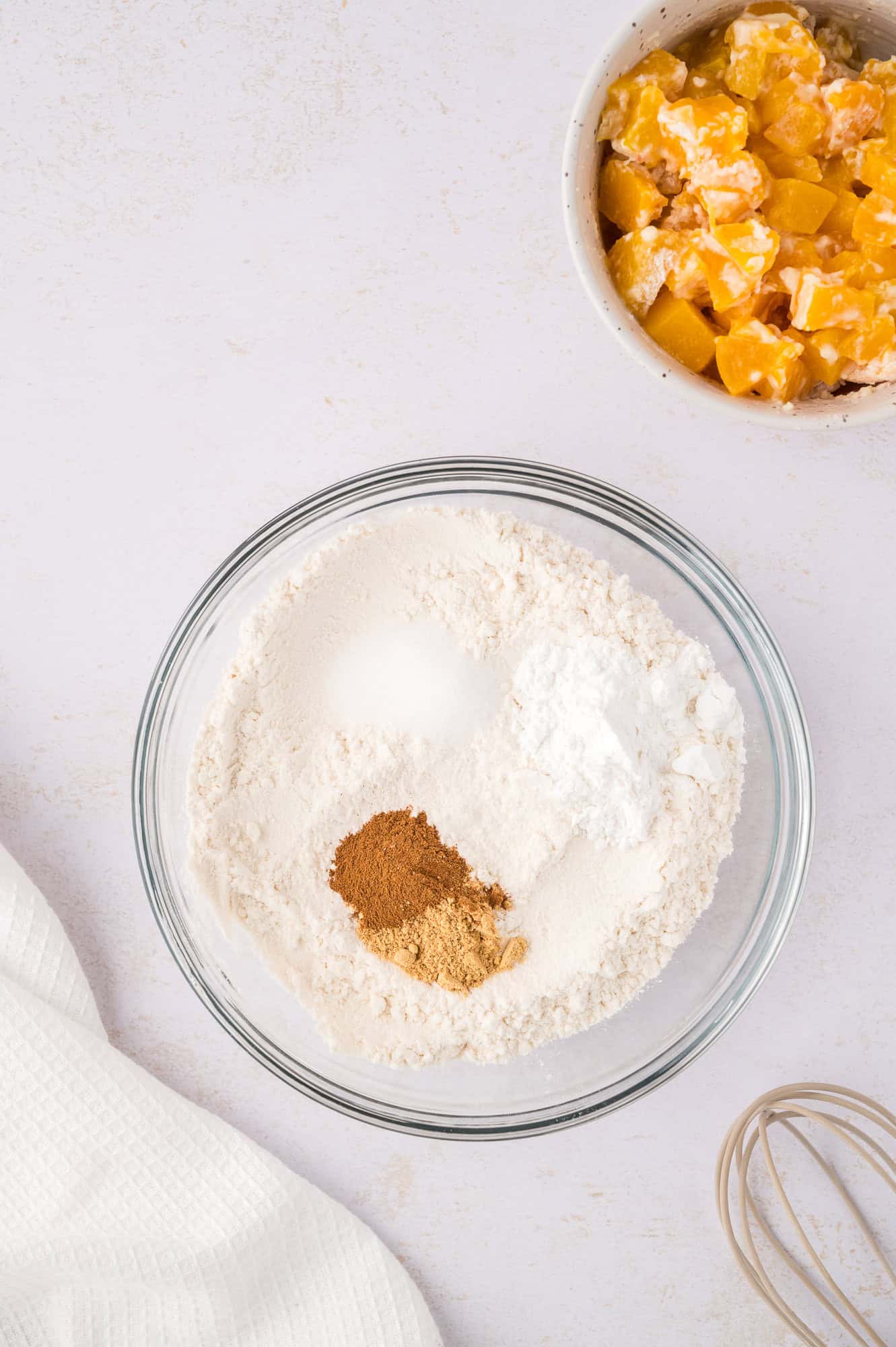 Dry ingredients in clear glass bowl, before mixing.