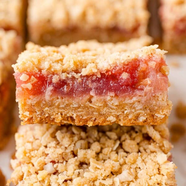 Rhubarb bars, with crumb topping, stacked on each other.