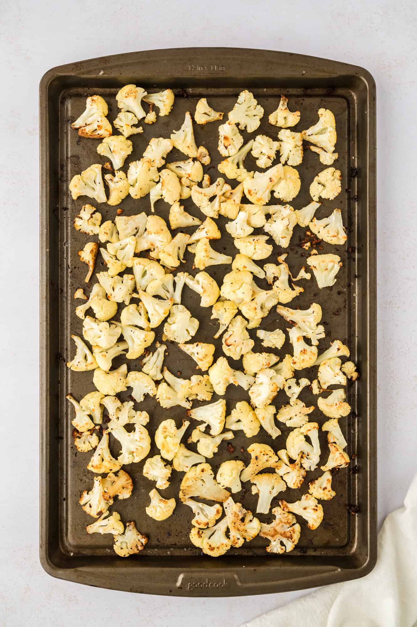 Roasted cauliflower on a baking sheet.
