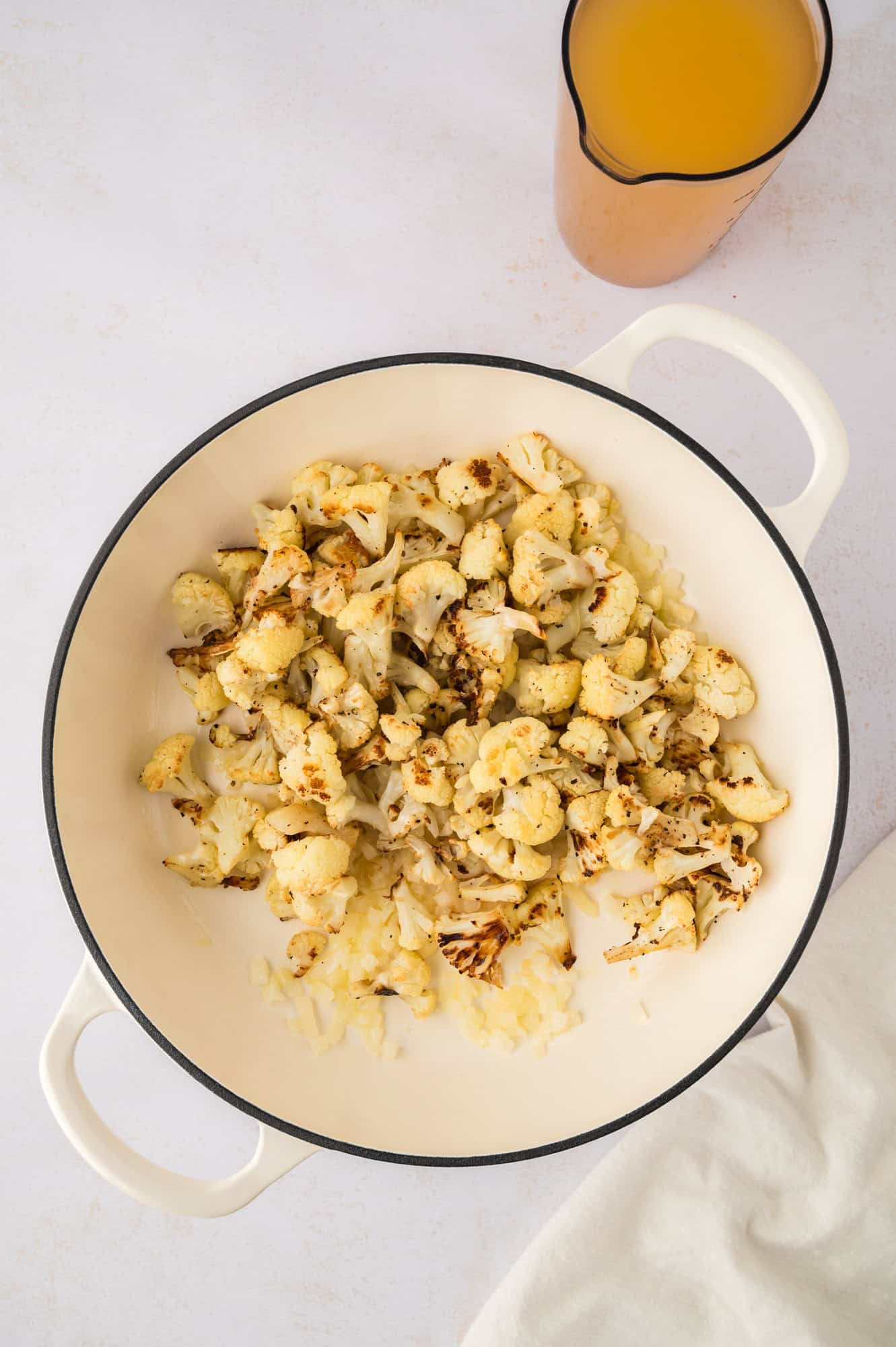 Cauliflower added to pan.