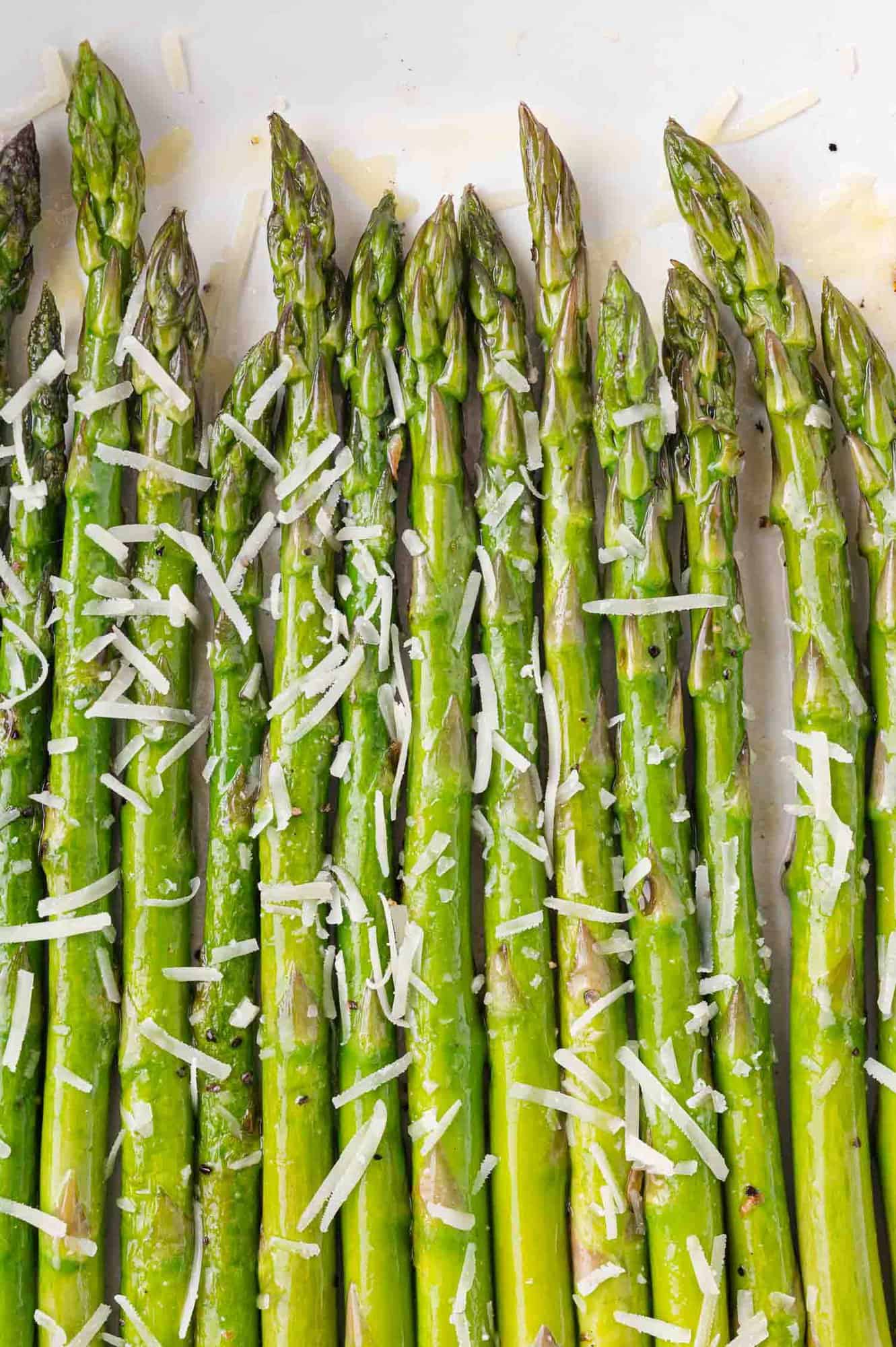 Sautéed asparagus spears topped with parmesan cheese.