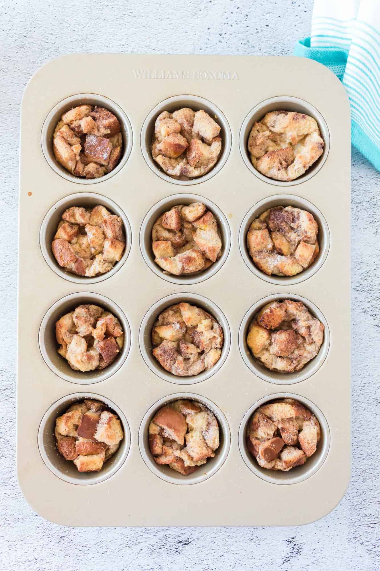 Baked French toast muffins, still in muffin tin.