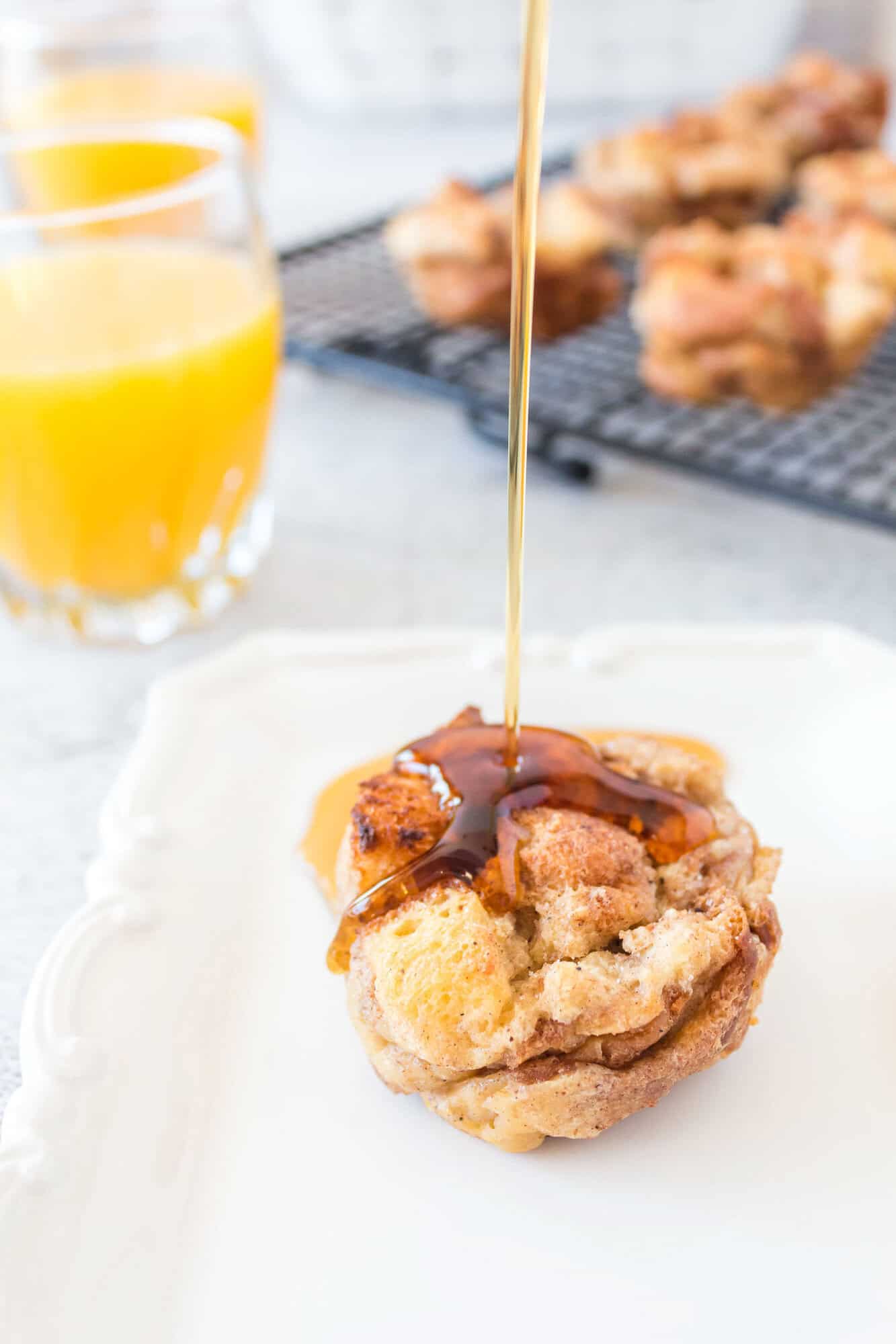 Syrup being drizzled on a French toast muffin.