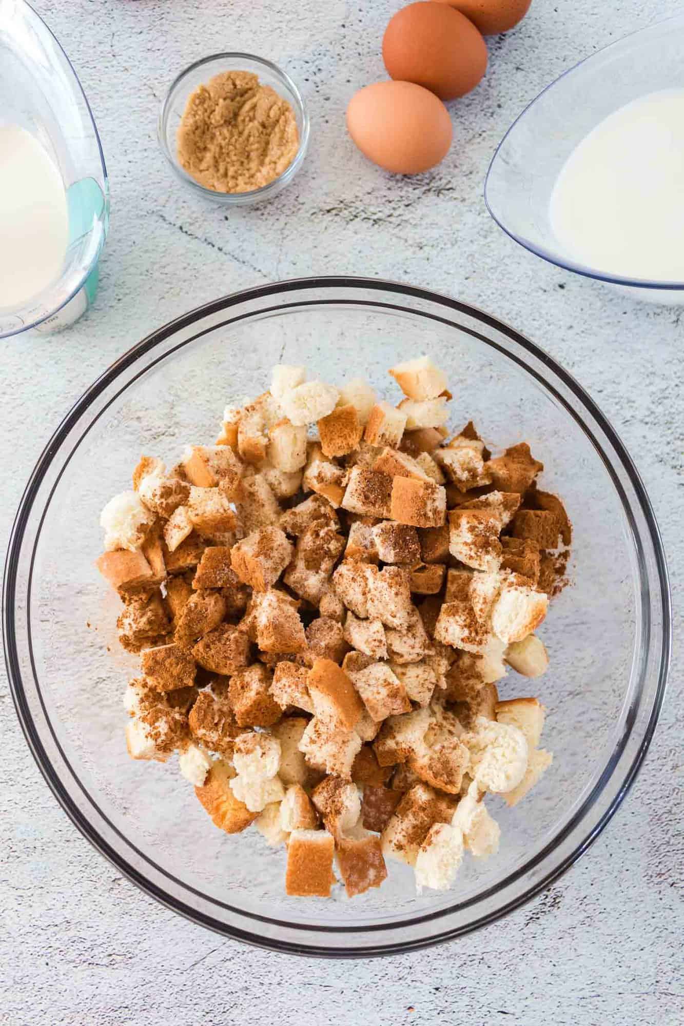 Bread cubes topped with cinnamon and nutmeg.